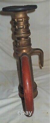 Antique Elkhart Brass Fireman Hose Nozzle Doorstop Art Fire Man Tool Lamp Statue