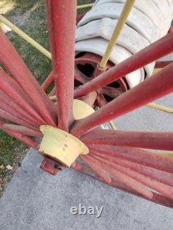 Antique Hand Drawn Fire Hose Transporter with Hose and nozzle