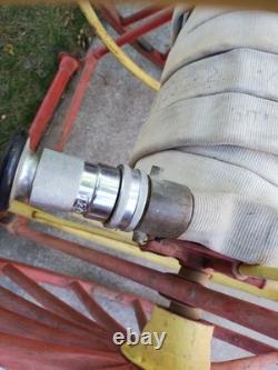 Antique Hand Drawn Fire Hose Transporter with Hose and nozzle