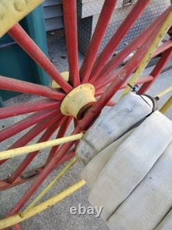 Antique Hand Drawn Fire Hose Transporter with Hose and nozzle