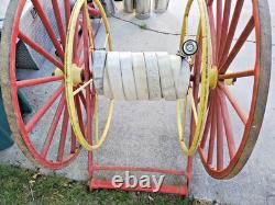 Antique Hand Drawn Fire Hose Transporter with Hose and nozzle