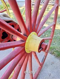 Antique Hand Drawn Fire Hose Transporter with Hose and nozzle