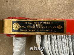 Standard Fire Hose Co. Hose/Brass Nozzle/Pin Rack Complete Used Look
