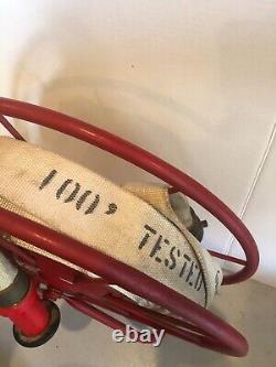 VINTAGE Fire Hose 100' with Reel and Hose Attachment Approx 23 Height Total