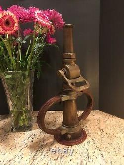 Vintage Wooster brass 2 1/2 in. Fire nozzle with leather handles