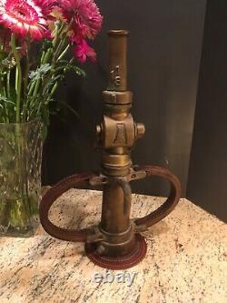 Vintage Wooster brass 2 1/2 in. Fire nozzle with leather handles