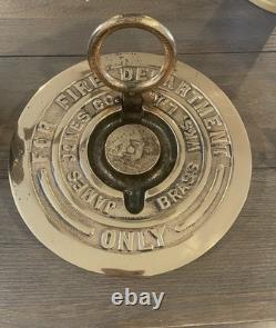 Vintage circular brass plate or cap FOR FIRE DEPARTMENT JAMES JONES CO. BRASS