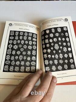 Ancien catalogue de matériel de lutte contre l'incendie Eureka, avec des insignes de pompier et des buses.