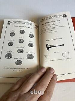 Ancien catalogue de matériel de lutte contre l'incendie Eureka, avec des insignes de pompier et des buses.