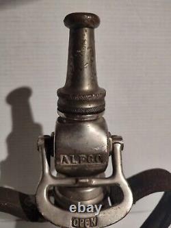 Ancienne buse de tuyau d'incendie en laiton massif American LaFrance 16, brevetée en 1917 avec poignée en cuir